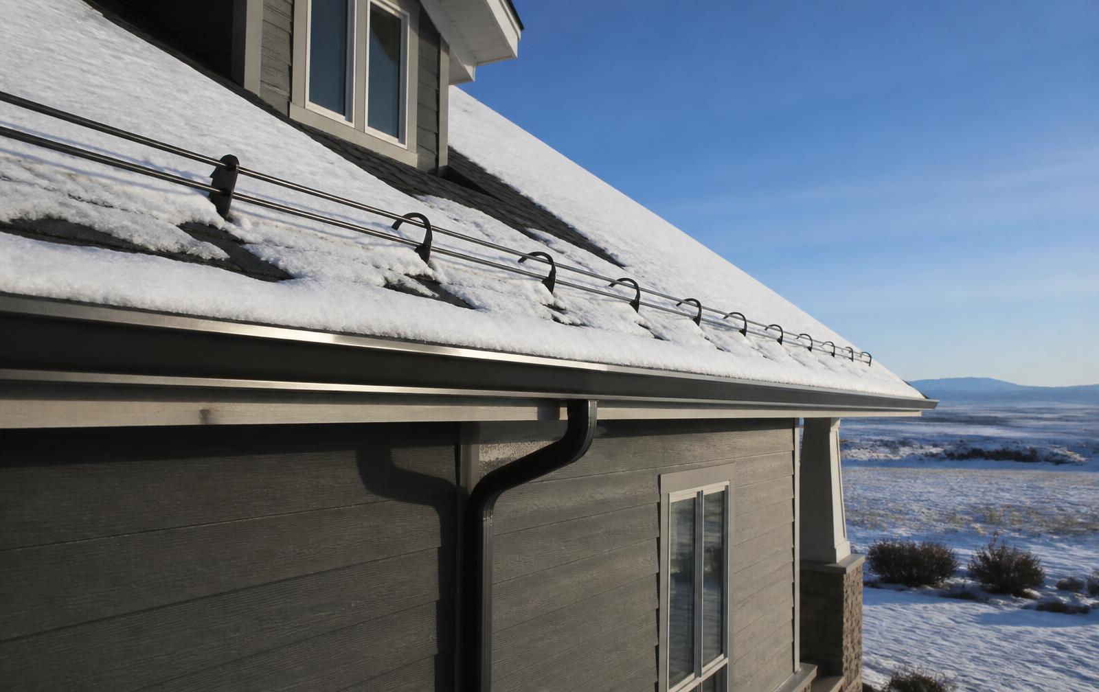 Snow guards, heat cable and gutter system on an Eastern Idaho home in winter